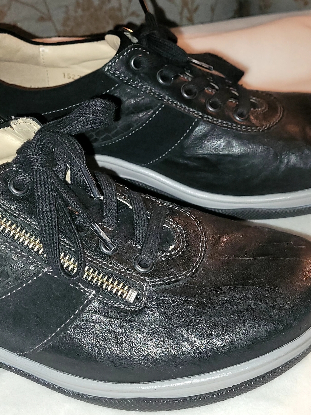 Women's Black Leather Zip-Accent Casual Sneakers